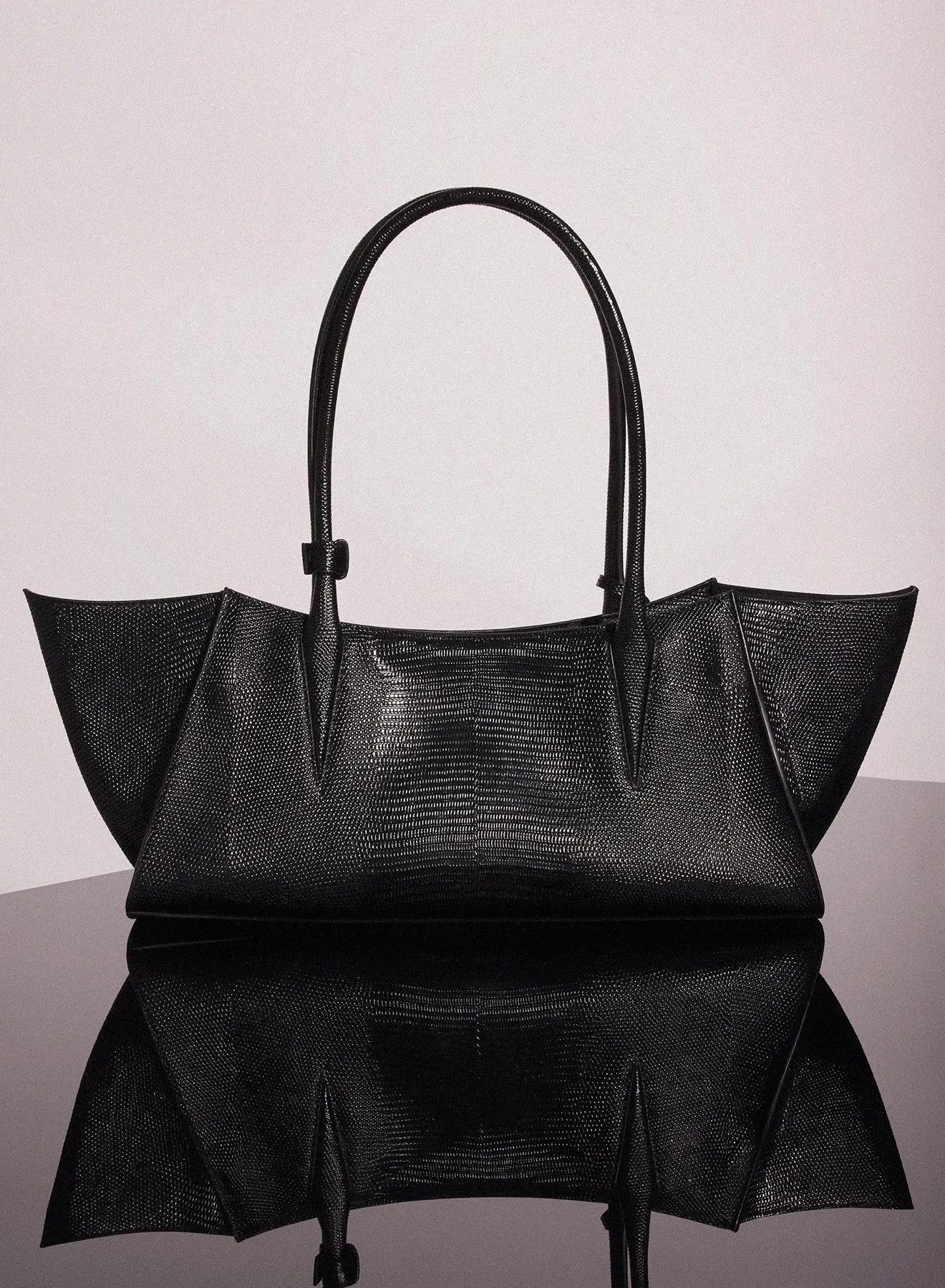 black embossed lizard leather fang bag