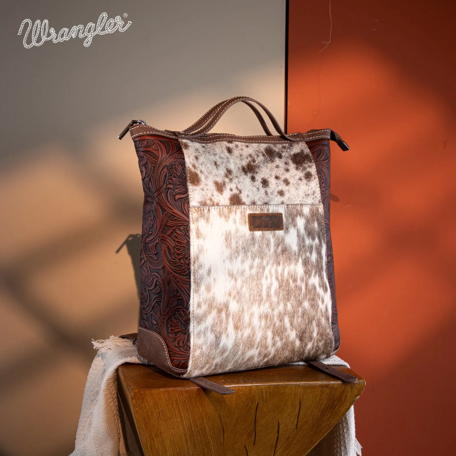 WG169-9112 Wrangler Genuine Hair-On Cowhide Floral Tooled Convertible Backpack/Crossbody - Coffee