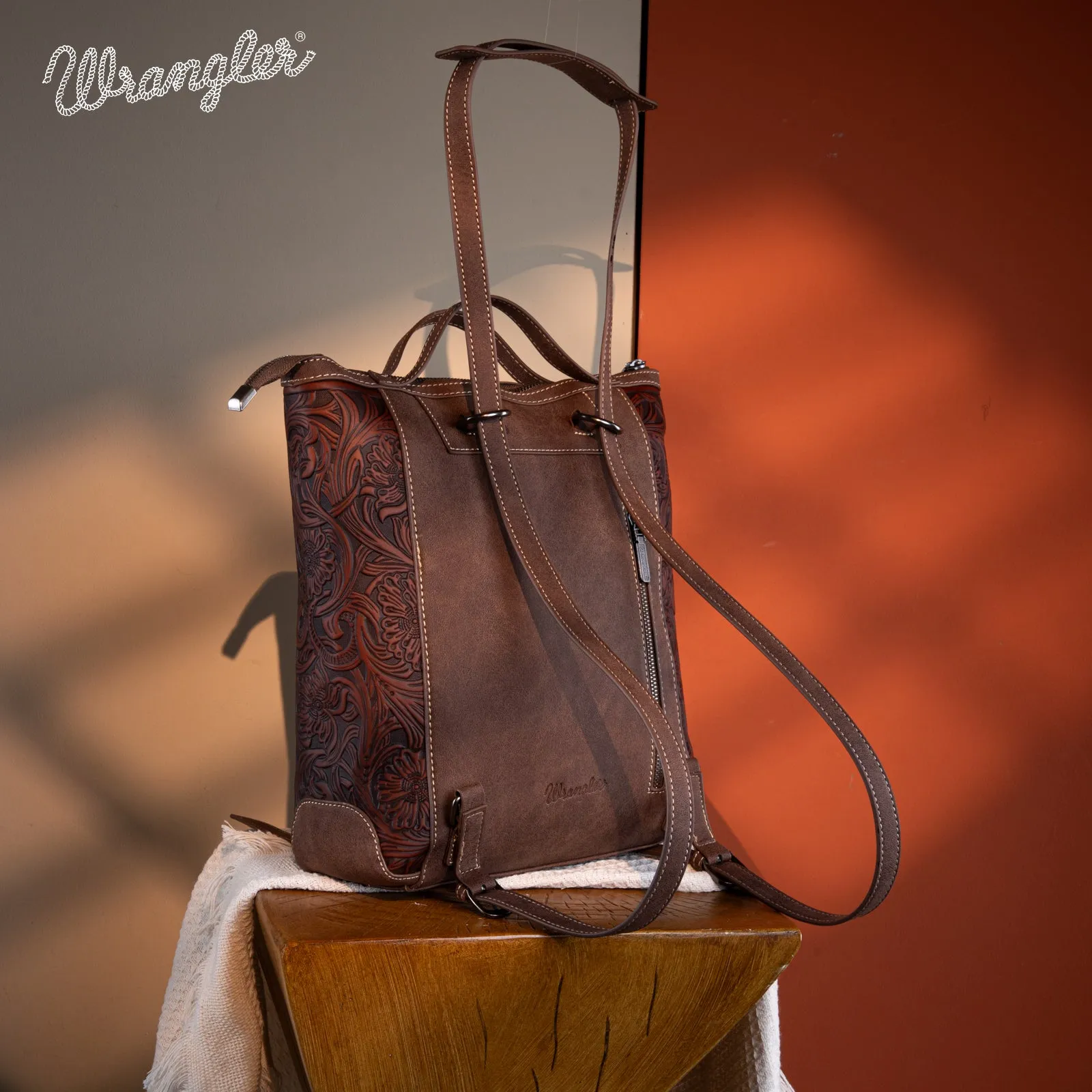 WG169-9112 Wrangler Genuine Hair-On Cowhide Floral Tooled Convertible Backpack/Crossbody - Coffee