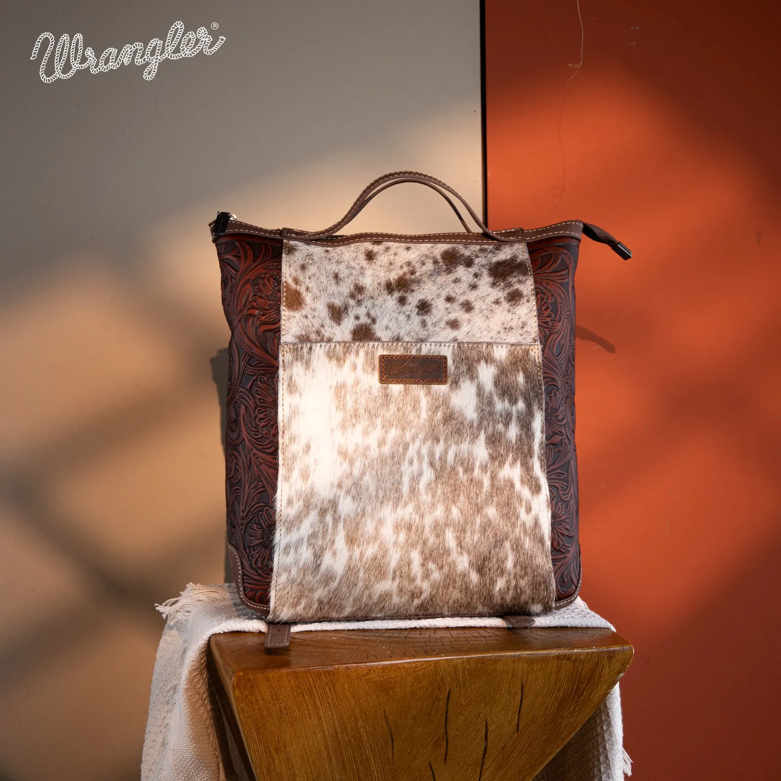 WG169-9112 Wrangler Genuine Hair-On Cowhide Floral Tooled Convertible Backpack/Crossbody - Coffee